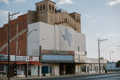 A vintage Texas theater marquee on a small-town main street.